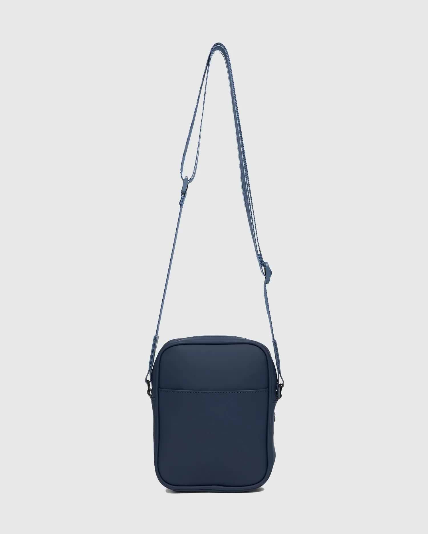 Premium Classic Bunny Messenger Bag in deep navy blue, featuring a smooth, durable fabric, an adjustable striped shoulder strap, and a discreet front slip pocket.