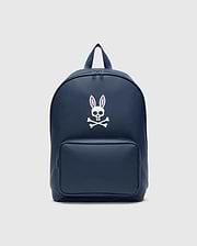 Classic Bunny Backpack in navy blue with a smooth matte finish, featuring a large white and pink Psycho Bunny skull logo centered on the front and a zippered front pocket.