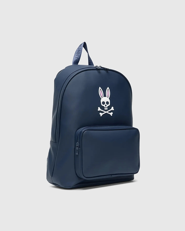 Classic Bunny Backpack in navy blue, featuring a large white and pink Psycho Bunny skull logo on the front, a zippered pocket, and a branded top handle. Smooth finish.