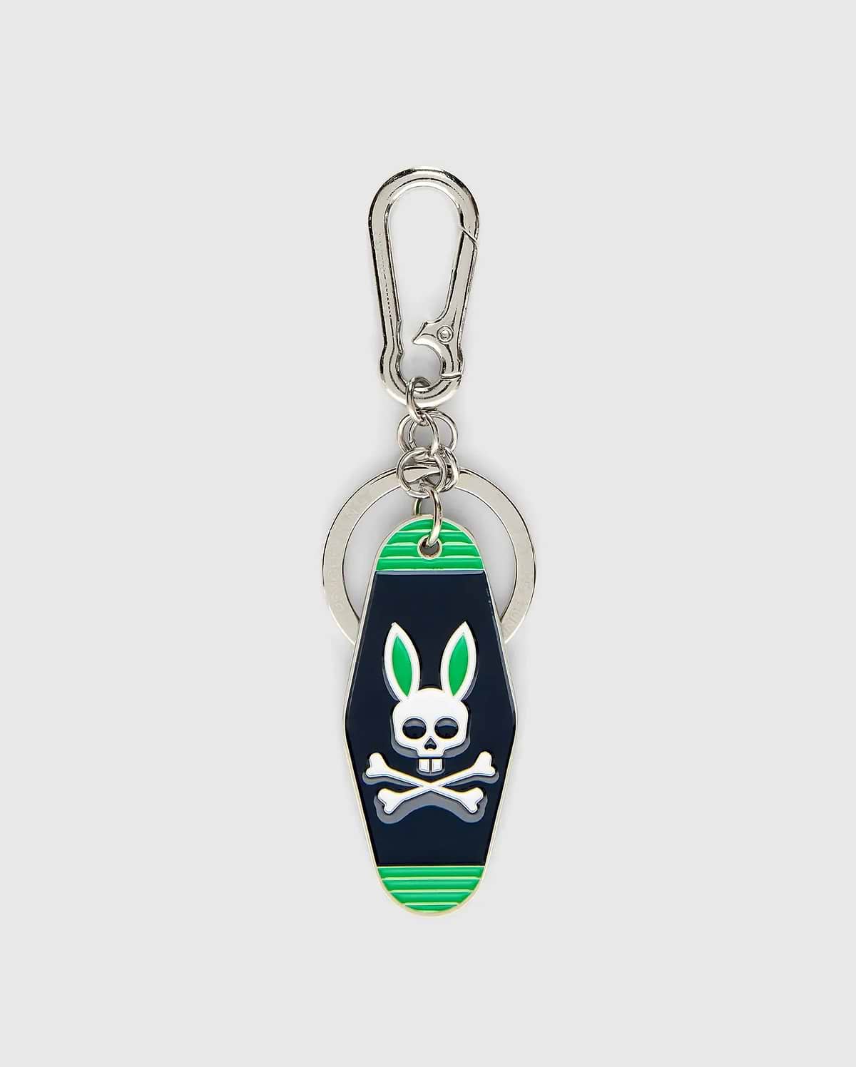 Mens Motel Keychain featuring a dark navy fob with bright green stripes and a prominent white Psycho Bunny skull logo with green ears, attached to a silver carabiner clip and key ring. (1)