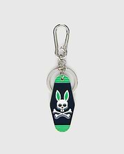 Mens Motel Keychain featuring a dark navy fob with bright green stripes and a prominent white Psycho Bunny skull logo with green ears, attached to a silver carabiner clip and key ring. (1)