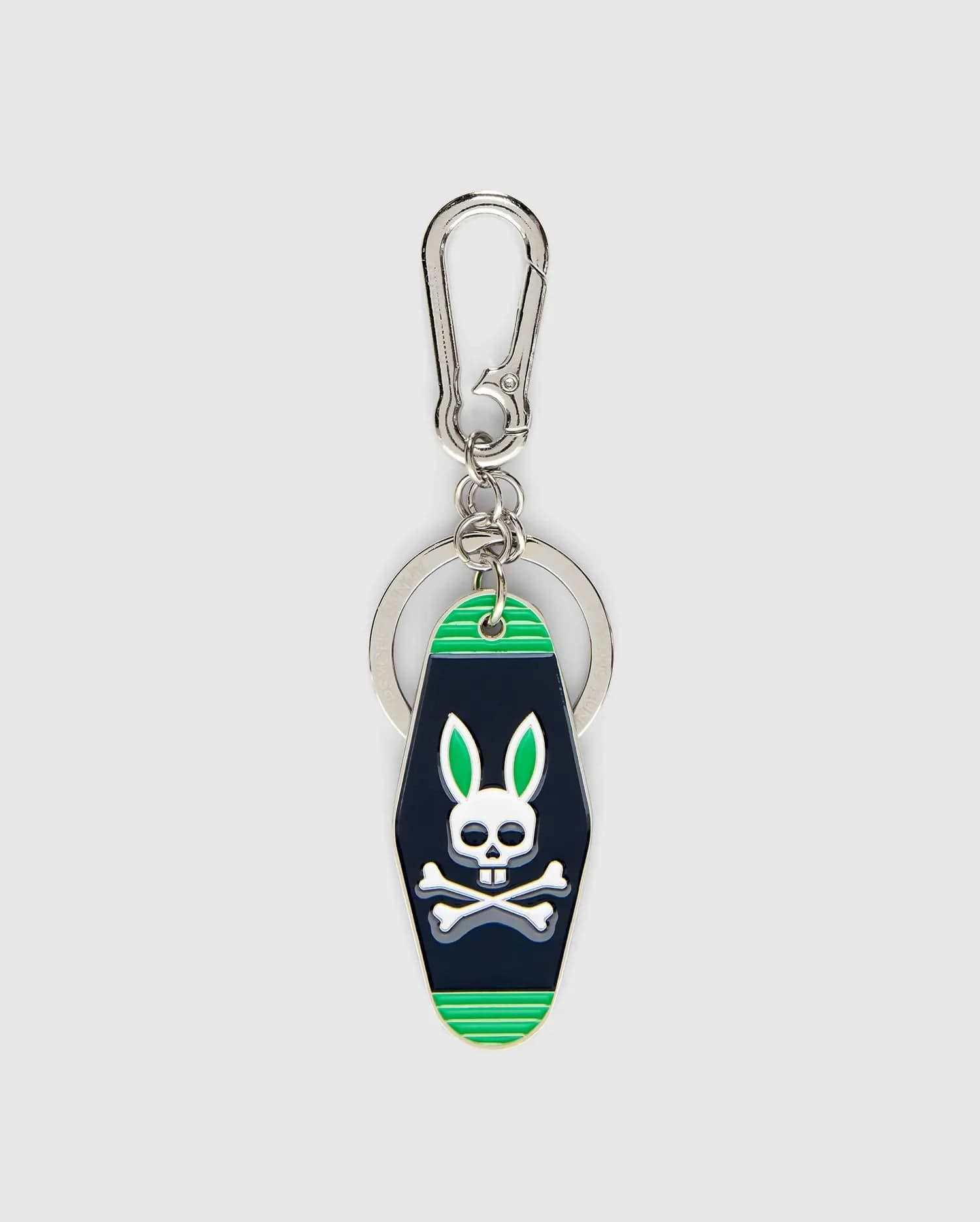 Mens Motel Keychain featuring a dark navy fob with bright green stripes and a prominent white Psycho Bunny skull logo with green ears, attached to a silver carabiner clip and key ring. (1)