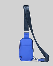 Vibrant Blue Rubberized Crossbody Bag with a smooth texture, featuring a dark navy adjustable strap with repeated Psycho Bunny text, a front zipper, D-ring, and carabiner clip.