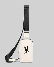 Mens Rubberized Crossbody in off-white with a large black Psycho Bunny skull logo on the front. Features a black adjustable strap with repeated Psycho Bunny branding and a black zipper.