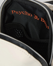 Mens Rubberized Crossbody bag, featuring a cream exterior trim and a black textured interior lining with a mesh pocket, boldly printed with the orange Psycho Bunny skull logo.