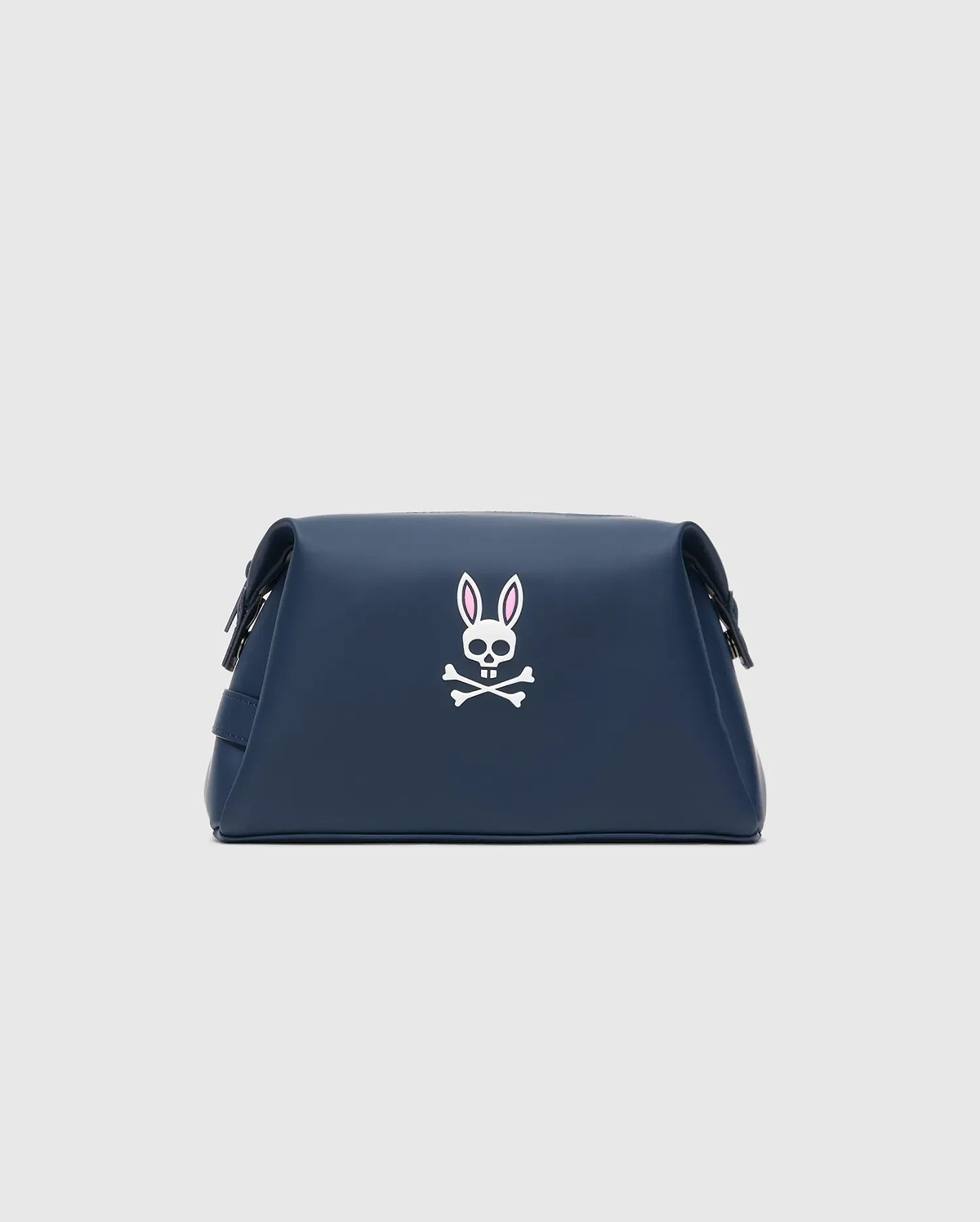 Classic Bunny Toiletry Kit in navy blue with a smooth texture, featuring a prominent white and pink Psycho Bunny skull logo centered on the front.