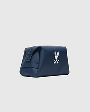 Classic Bunny Toiletry Kit, a sleek navy blue bag with a smooth, matte finish, featuring a prominent white and pink embroidered Psycho Bunny skull logo on the front.