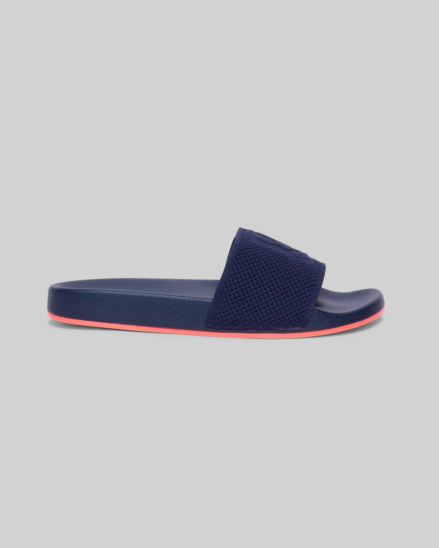 Mens Contrast Sole Knit Slides in navy, featuring a textured knit strap with a subtle, tone-on-tone Psycho Bunny logo and a vibrant coral rubber sole. (2)