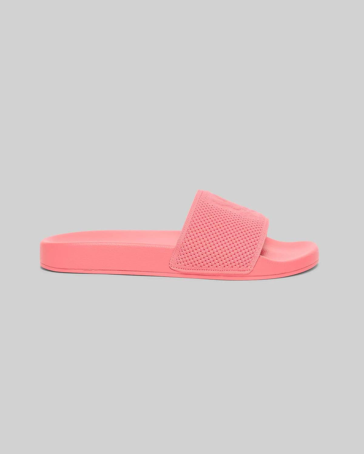 Coral pink Mens Knit Slides featuring a textured knitted upper strap with an embossed Psycho Bunny skull logo and a smooth, contoured sole. (2)