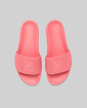 Mens Knit Slides in vibrant coral pink, featuring a textured knit strap with a prominent debossed Psycho Bunny skull logo, and a matching textured rubber sole for comfort. (3)