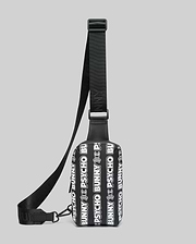 Mens Rubberized Crossbody bag featuring an all-over white repeating Psycho Bunny text and skull logo pattern on a black rubberized body with a black woven adjustable strap.