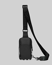 Mens Rubberized Crossbody bag in black, featuring a sleek rubberized finish, white abstract side panel pattern, and a black webbing strap with repeating Psycho Bunny text branding.