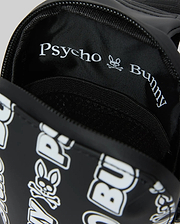 Mens Rubberized Crossbody in black with a white all-over Psycho Bunny text and skull logo print, featuring a rubberized exterior and woven interior lining with repeating branding.