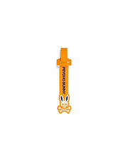 Mens Silicone Strap Luggage Tag in vibrant orange, showcasing bold vertical blue Psycho Bunny text and a prominent white and blue bunny skull logo design. (1)