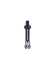 Mens Silicone Strap Luggage Tag, a sleek dark navy blue silicone strap featuring prominent vertical white PSYCHO BUNNY text and a large, detailed white and pink bunny skull logo.
