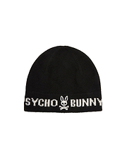 Black knitted Mens Eugene Wordmark Beanie with a ribbed cuff, featuring a large white Psycho Bunny wordmark and iconic bunny skull logo prominently displayed on the front.
