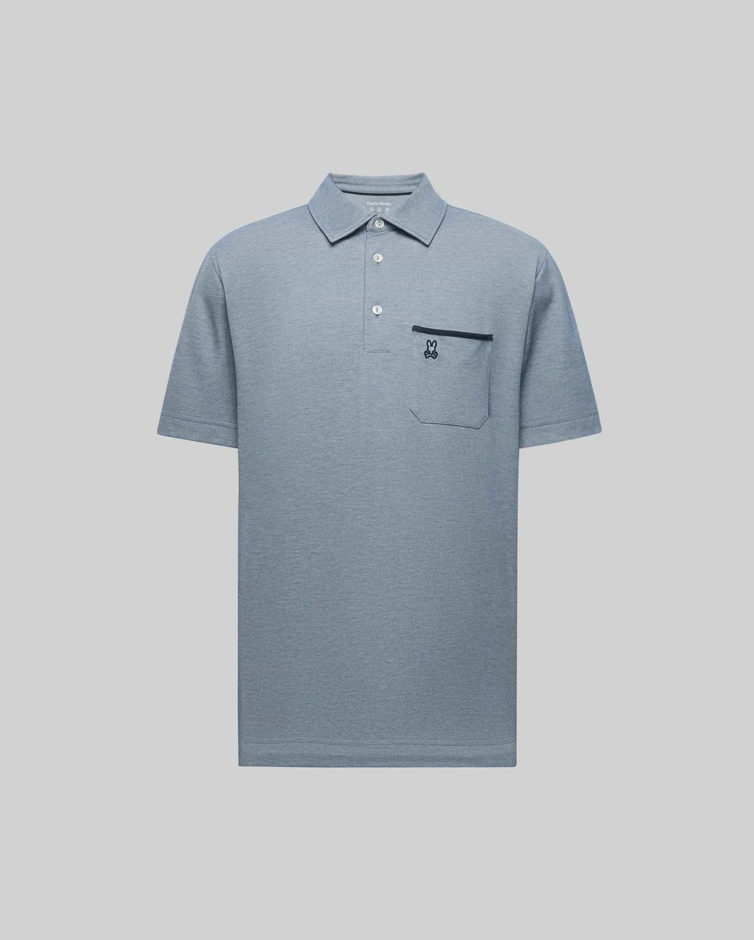 The Psycho Bunny MENS HADLEY PERFORMANCE PIQUE POLO (MT0100021) is a light blue short-sleeve collared shirt with three buttons and a chest pocket featuring an embroidered dark blue bunny logo, shown on a plain light grey background. (5)