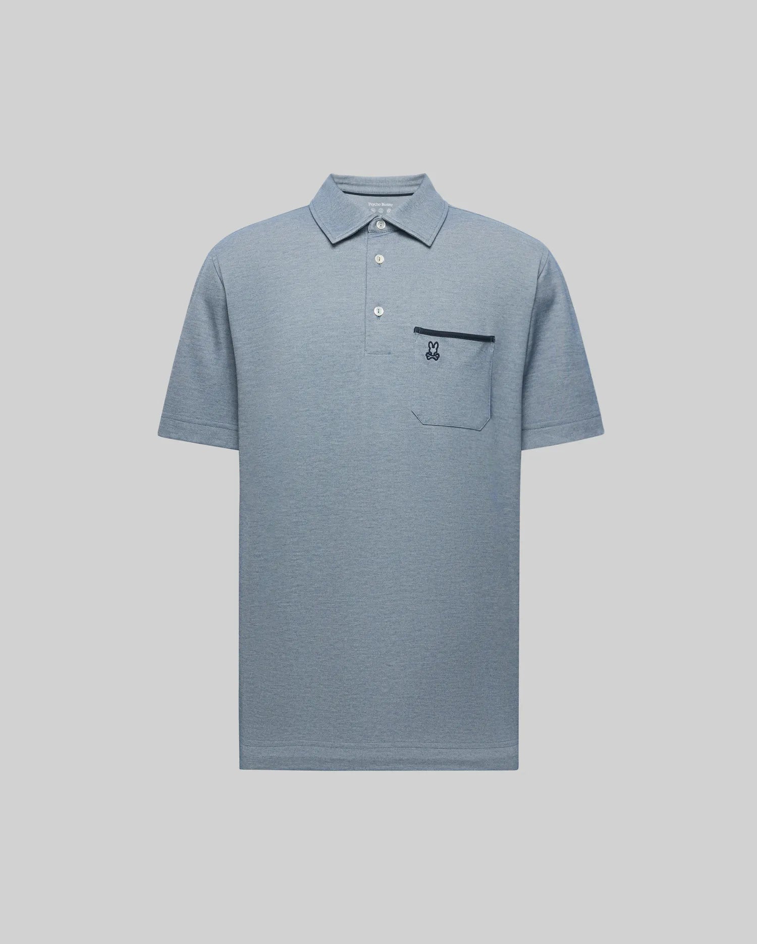 The Psycho Bunny MENS HADLEY PERFORMANCE PIQUE POLO (MT0100021) is a light blue short-sleeve collared shirt with three buttons and a chest pocket featuring an embroidered dark blue bunny logo, shown on a plain light grey background. (5)