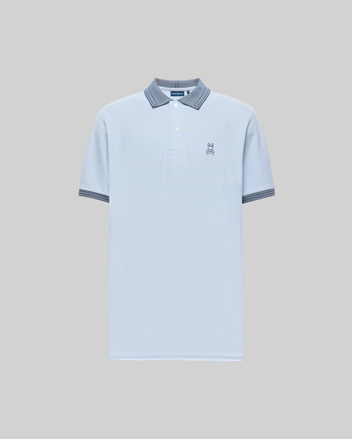 The Psycho Bunny Men's Murphy Pique Polo Shirt (MT0100026) is light blue, crafted from soft Pima cotton, with a buttoned collar, dark blue striped trim on the collar and cuffs, and a small embroidered Bunny logo on the chest. Plain gray background. (5)
