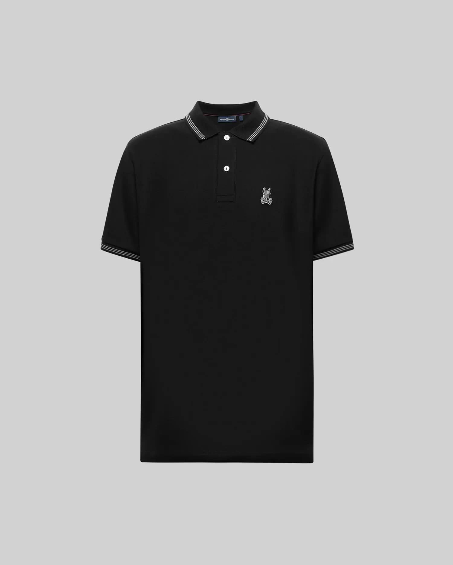 The Psycho Bunny MENS HART PIQUE POLO SHIRT (MT0100032) is a black short-sleeve Pima cotton polo with white-trimmed collar and sleeves, button placket, and an embroidered cartoon rabbit logo on the left chest. Shown on a gray background. (5)