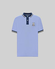 The Psycho Bunny MENS WADE PIQUE POLO (MT0100044) features light blue Pima cotton, a navy collar, white buttons, signature bunny patch on the chest, and navy & white colorblock tipped cuffs. Shown on a plain gray background. (5)