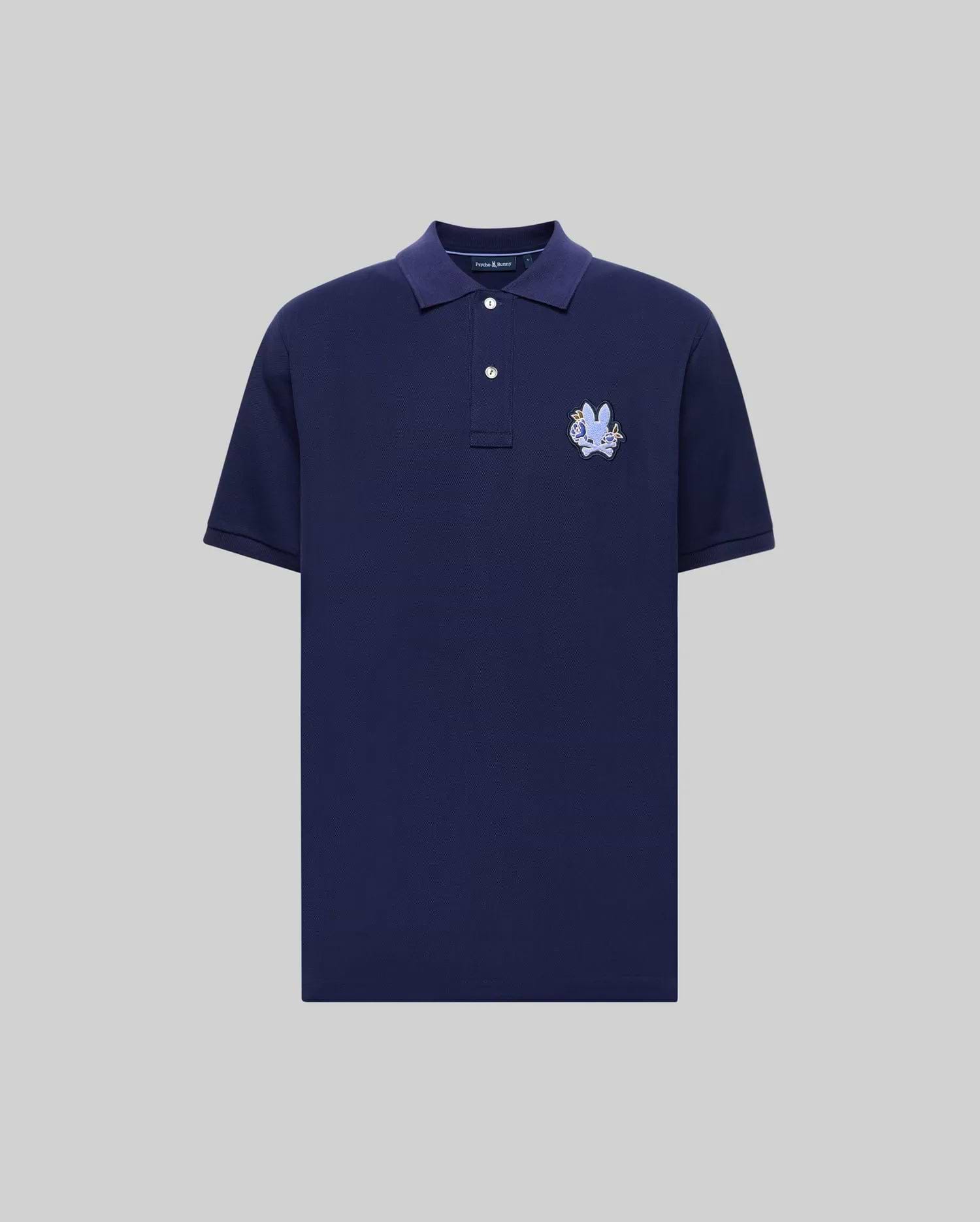 The Psycho Bunny MENS AUGUSTE PIQUE POLO SHIRT (MT0100051) is a varsity-style, navy blue short-sleeve polo made from soft Pima cotton, with a collar, two white buttons, and an embroidered blue and white crest on the left chest. (5)