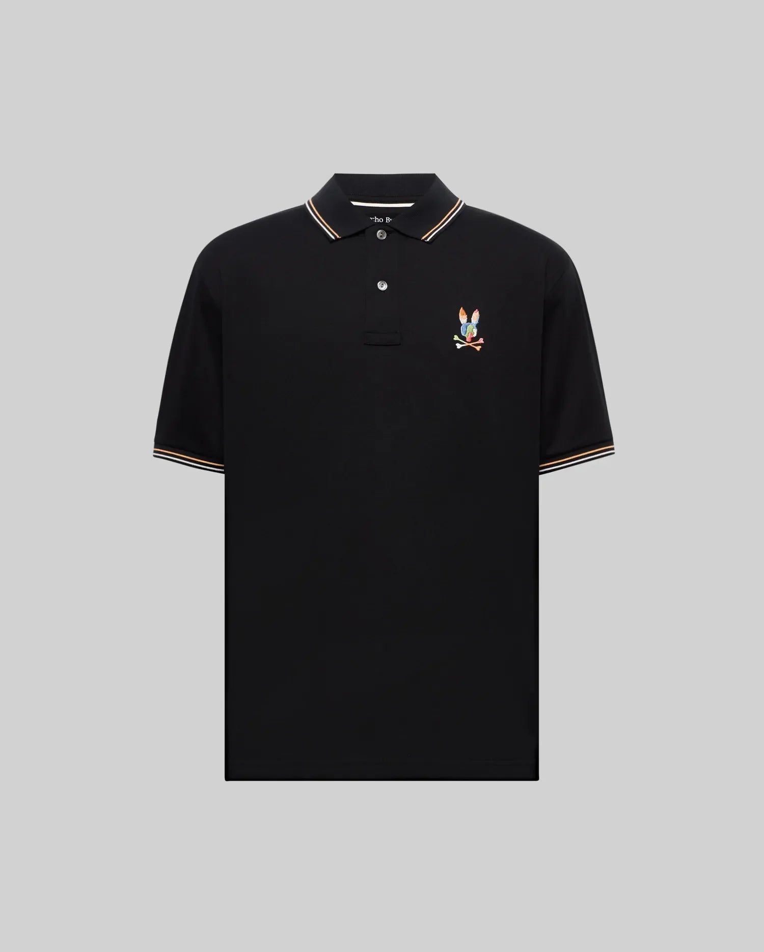 Mens Ara Pique Polo, black classic fit with white and orange striped ribbed collar and cuffs, featuring a vibrant embroidered multicolored Psycho Bunny skull and crossbones logo on the left chest.