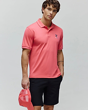 Mens Ara Pique Polo, a coral classic fit pique polo with white tipped collar and cuffs, featuring an embroidered multi-color Psycho Bunny skull logo on the left chest. (3)