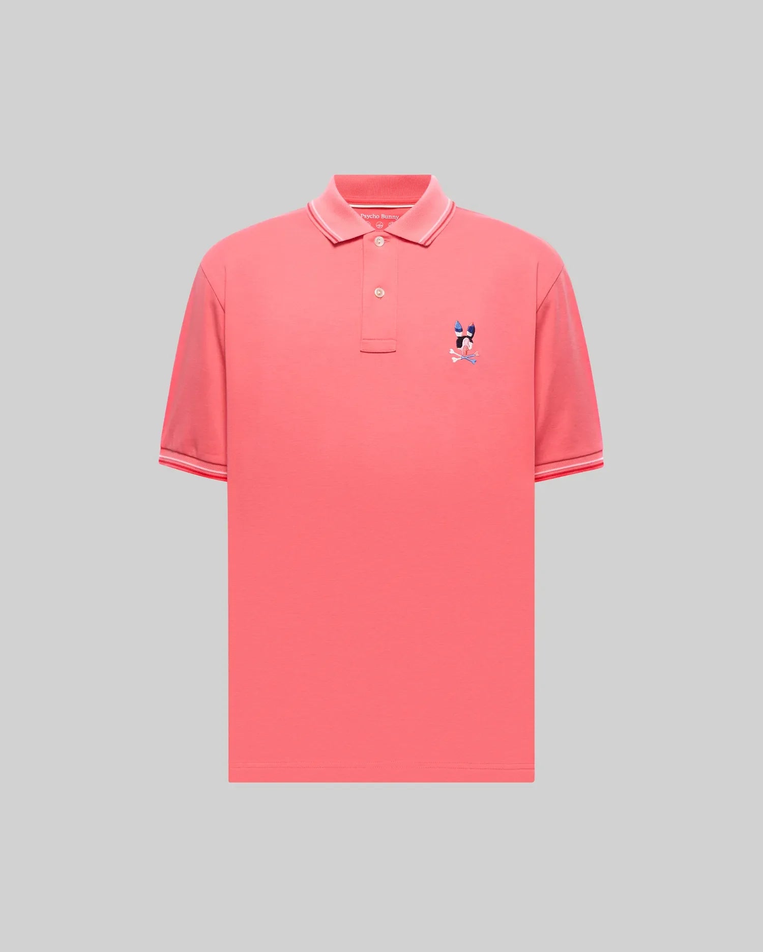 Mens Ara Pique Polo in vibrant coral pique, featuring a classic fit, ribbed collar and cuffs with white and red tipping, and a small embroidered multi-color Psycho Bunny skull logo on the left chest. (5)