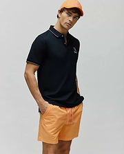 Mens Olivier Pique Polo in black, featuring a classic fit, white tipped collar and cuffs, and an embroidered white Psycho Bunny skull logo on the left chest. (1)
