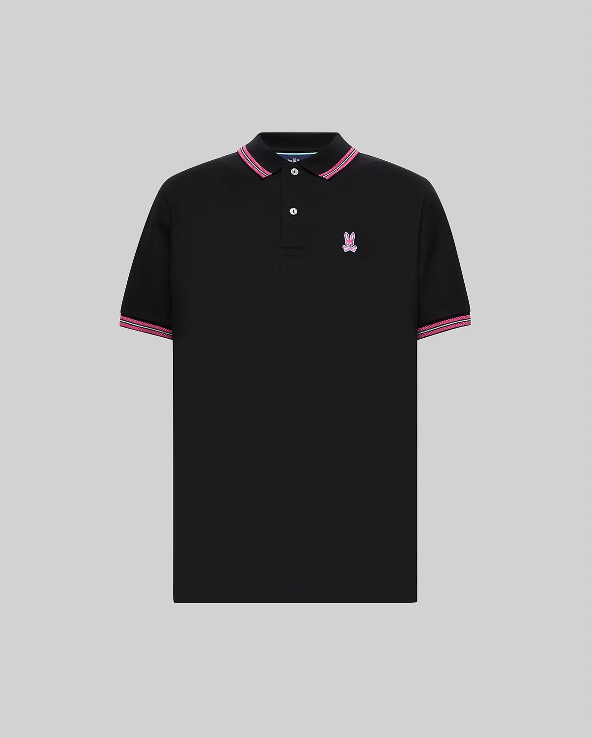 Mens Clark Pique Polo, a black classic fit pique polo with pink and white striped collar and cuffs, featuring an embroidered pink Psycho Bunny skull logo on the left chest.