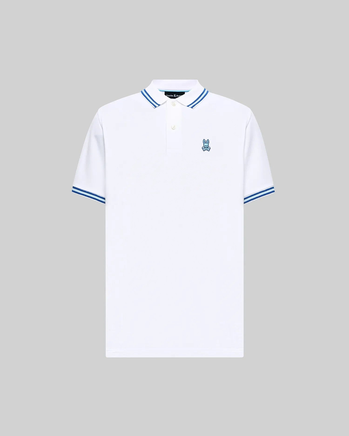 Mens Clark Pique Polo, a classic fit white pique polo with blue striped collar and cuffs, featuring a small blue embroidered Psycho Bunny skull logo on the left chest. (5)
