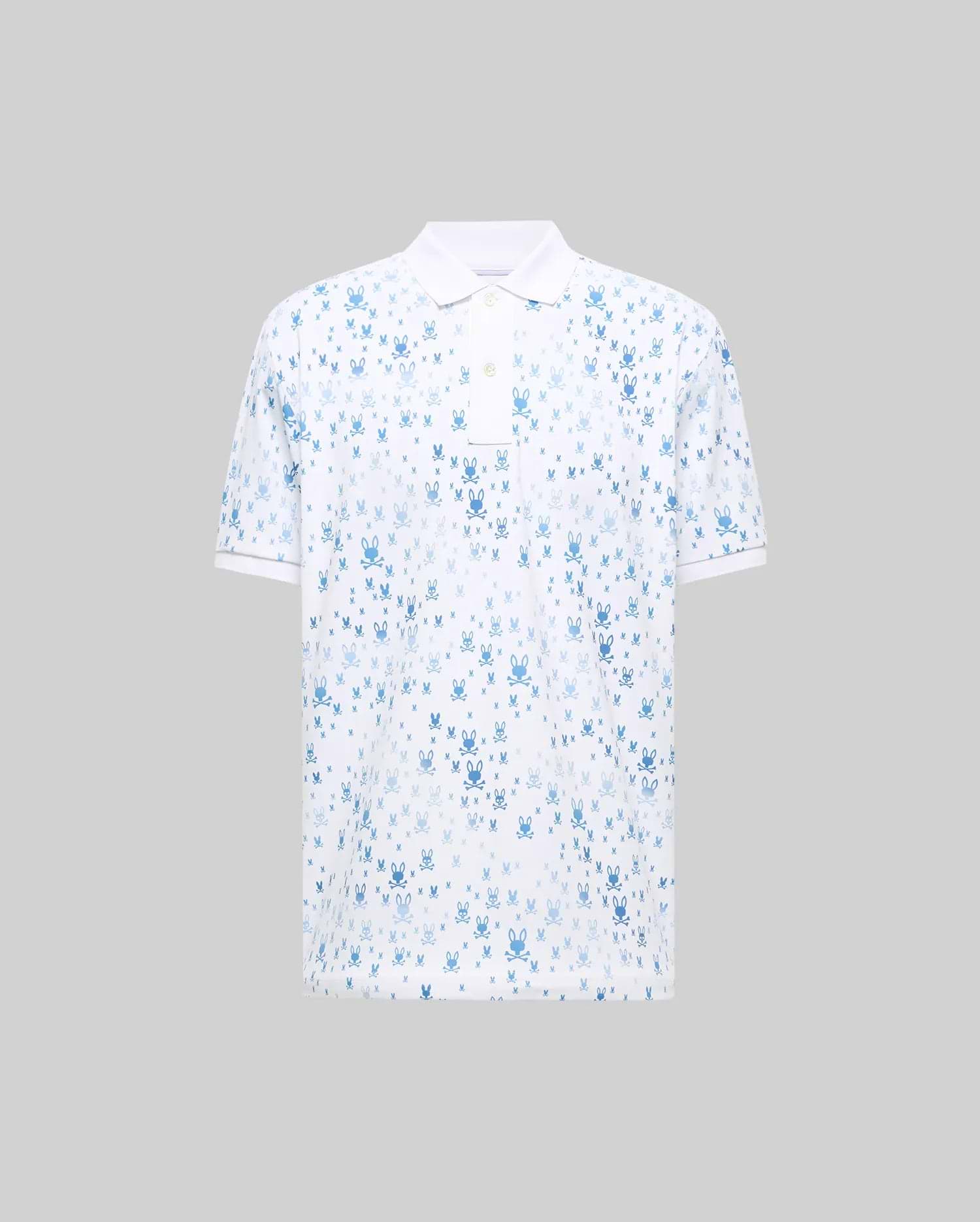 Mens Nev Sport Polo. White pique knit, classic fit polo featuring an all-over blue Psycho Bunny skull logo print, with a crisp white collar, two-button placket, and short ribbed cuffs.