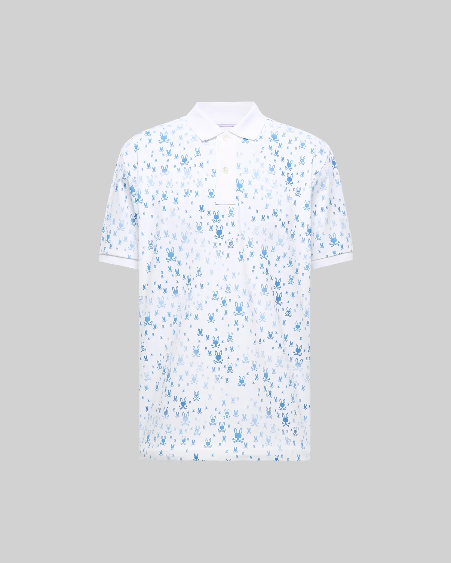 Mens Nev Sport Polo. White pique knit, classic fit polo featuring an all-over blue Psycho Bunny skull logo print, with a crisp white collar, two-button placket, and short ribbed cuffs.
