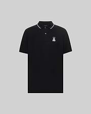 Mens Aram Pique Polo, a classic fit black pique polo with white tipping on the collar and sleeve cuffs, featuring an embroidered white Psycho Bunny skull logo on the left chest. (5)