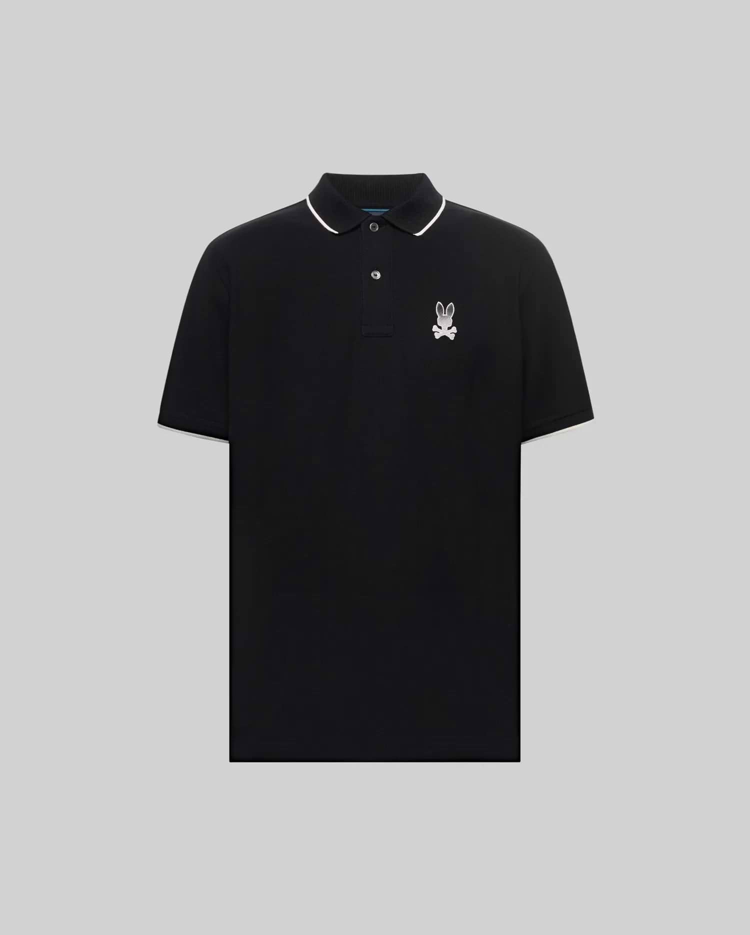 Mens Aram Pique Polo, a classic fit black pique polo with white tipping on the collar and sleeve cuffs, featuring an embroidered white Psycho Bunny skull logo on the left chest. (5)