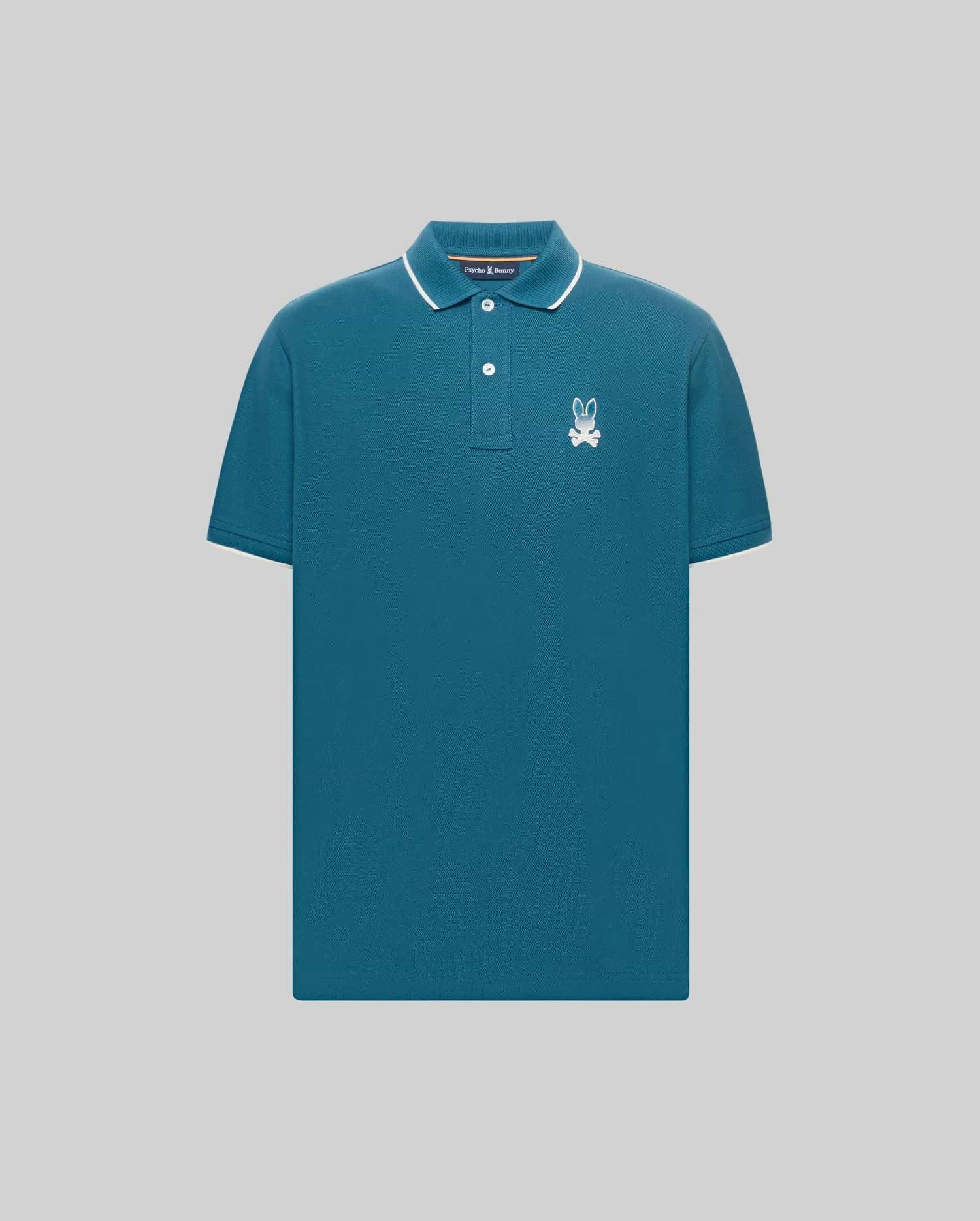 Mens Aram Pique Polo, a classic fit teal pique polo shirt with white tipped collar and cuffs, two-button placket, and an embroidered white Psycho Bunny skull logo on the left chest. (5)