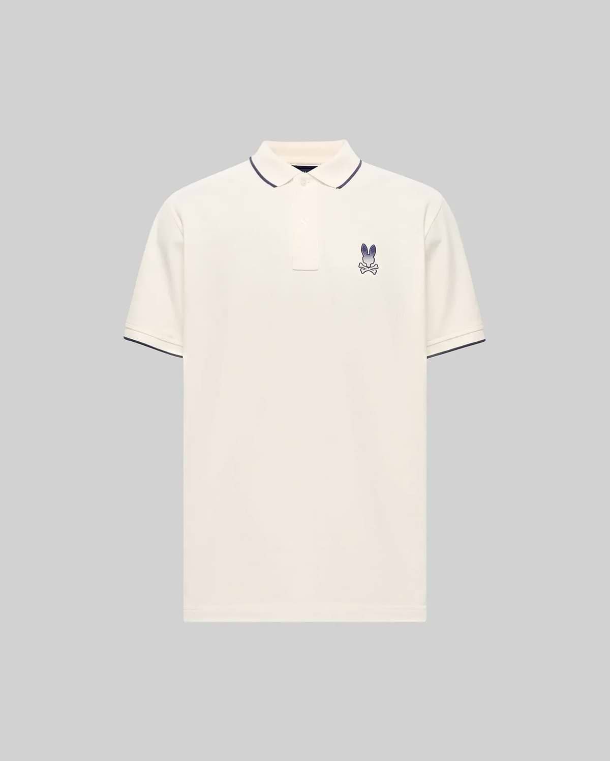 Cream Mens Aram Pique Polo with classic fit, featuring a small embroidered purple Psycho Bunny skull logo on the left chest and navy tipping on the ribbed collar and cuffs. (5)