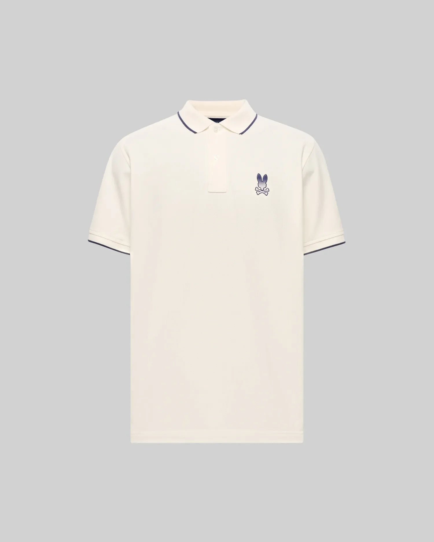 Cream Mens Aram Pique Polo with classic fit, featuring a small embroidered purple Psycho Bunny skull logo on the left chest and navy tipping on the ribbed collar and cuffs. (5)