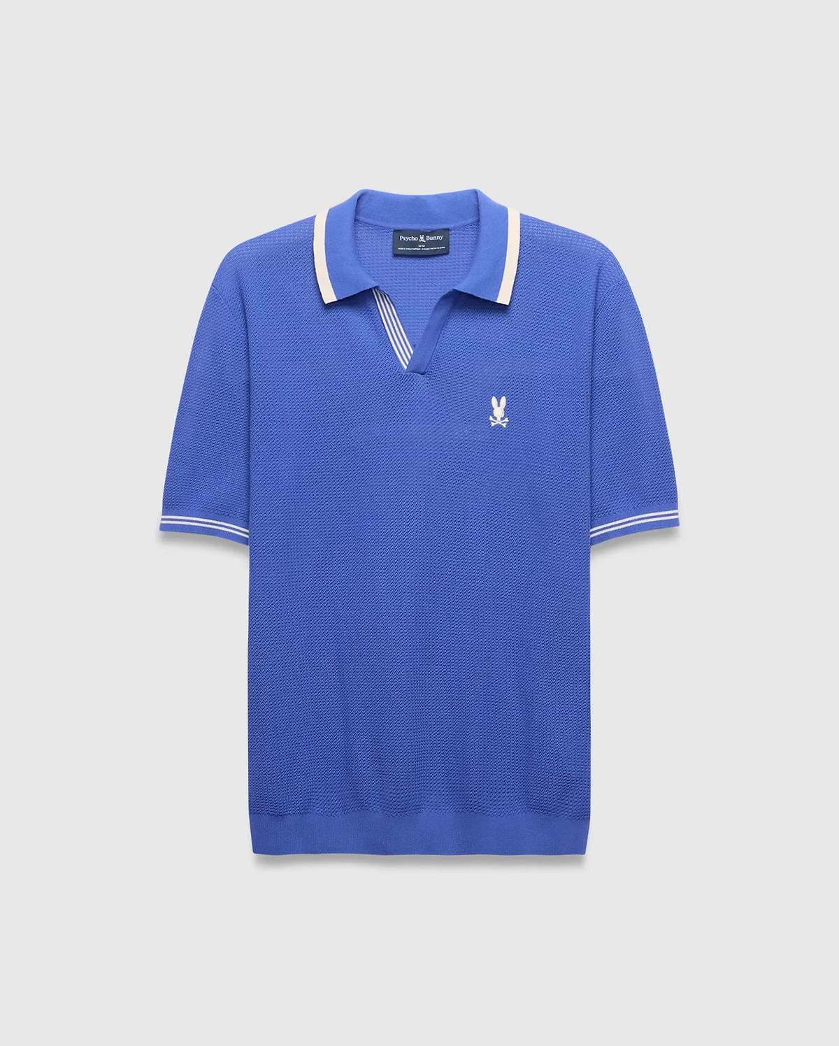 Mens Innis Polo, classic fit, vibrant blue pique knit with cream striped V-neck collar and cuffs, featuring a small embroidered white Psycho Bunny skull logo on the left chest. (5)