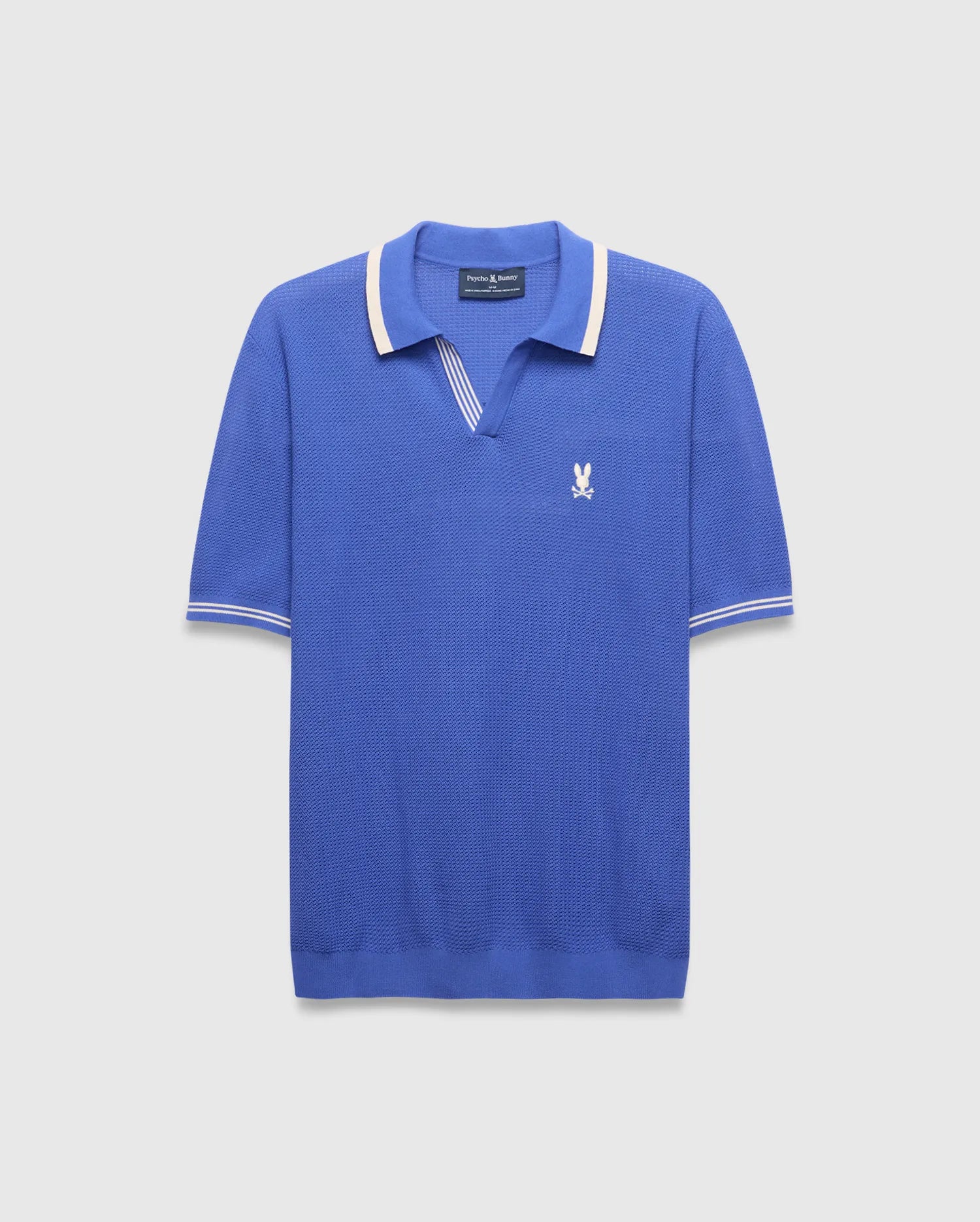 Mens Innis Polo, classic fit, vibrant blue pique knit with cream striped V-neck collar and cuffs, featuring a small embroidered white Psycho Bunny skull logo on the left chest. (5)