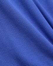 Mens Innis Polo crafted from premium, vibrant royal blue pique knit fabric, featuring a distinct, breathable texture and subtle, luxurious drape, reflecting Psycho Bunny's refined streetwear aesthetic. (6)