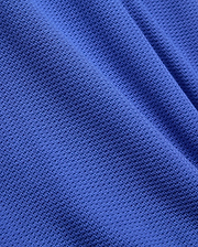 Mens Innis Polo crafted from premium, vibrant royal blue pique knit fabric, featuring a distinct, breathable texture and subtle, luxurious drape, reflecting Psycho Bunny's refined streetwear aesthetic. (6)