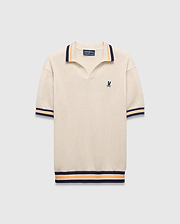 Mens Theros Knit Polo, cream textured knit with a relaxed fit, featuring a V-neck, navy and orange striped ribbed collar, cuffs, and hem, and a small embroidered navy Psycho Bunny skull logo on the left chest. (5)