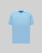 Mens Devon Knit Polo in light blue, featuring a textured knit fabric, open V-neck collar, ribbed cuffs and hem, and a small embroidered Psycho Bunny skull logo on the left chest.