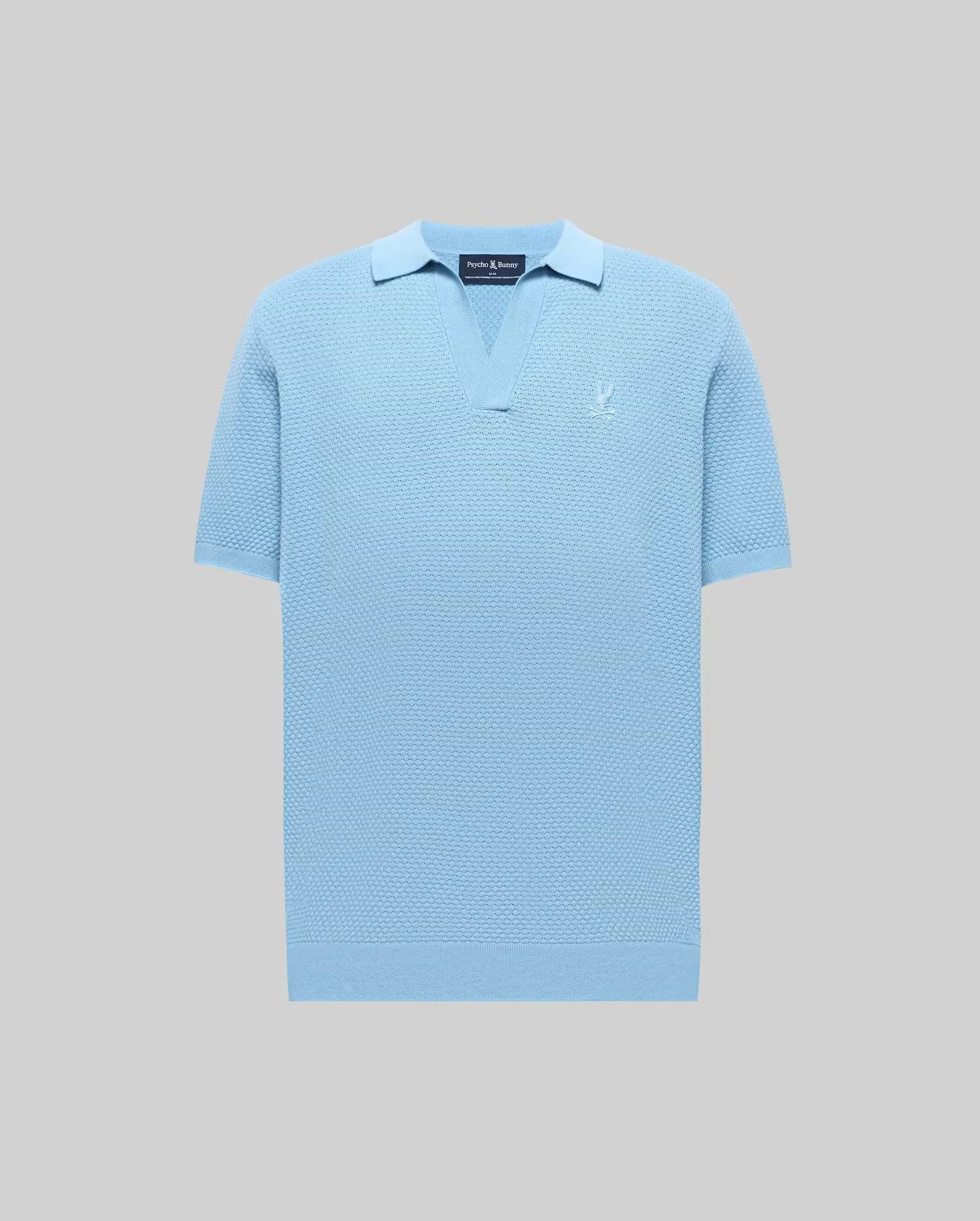 Mens Devon Knit Polo in light blue, featuring a textured knit fabric, open V-neck collar, ribbed cuffs and hem, and a small embroidered Psycho Bunny skull logo on the left chest.
