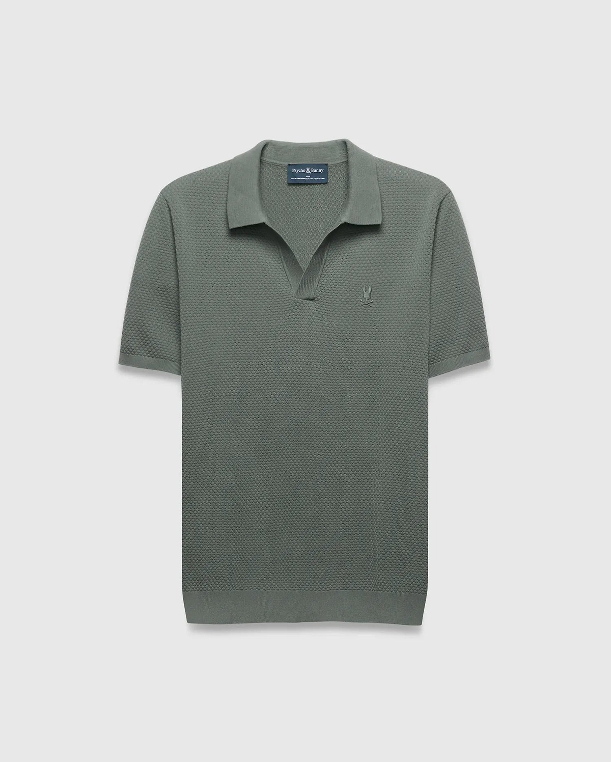 Mens Devon Knit Polo in sage green, featuring a textured knit fabric, open collar, and a small tonal embroidered Psycho Bunny skull logo on the left chest.