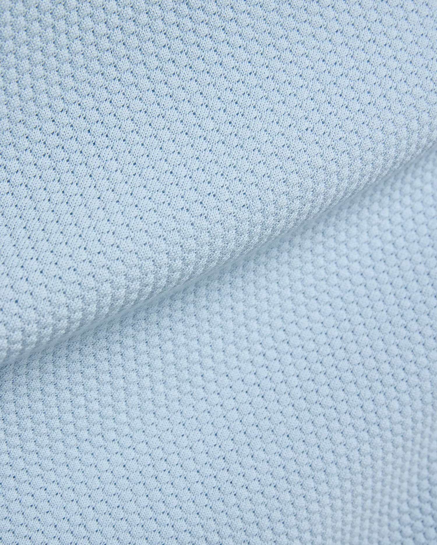 Light blue Mens Devon Bubble Stitch Knit Polo fabric, a premium menswear piece showcasing its unique, refined bubble stitch knit texture, perfect for sophisticated streetwear. (7)