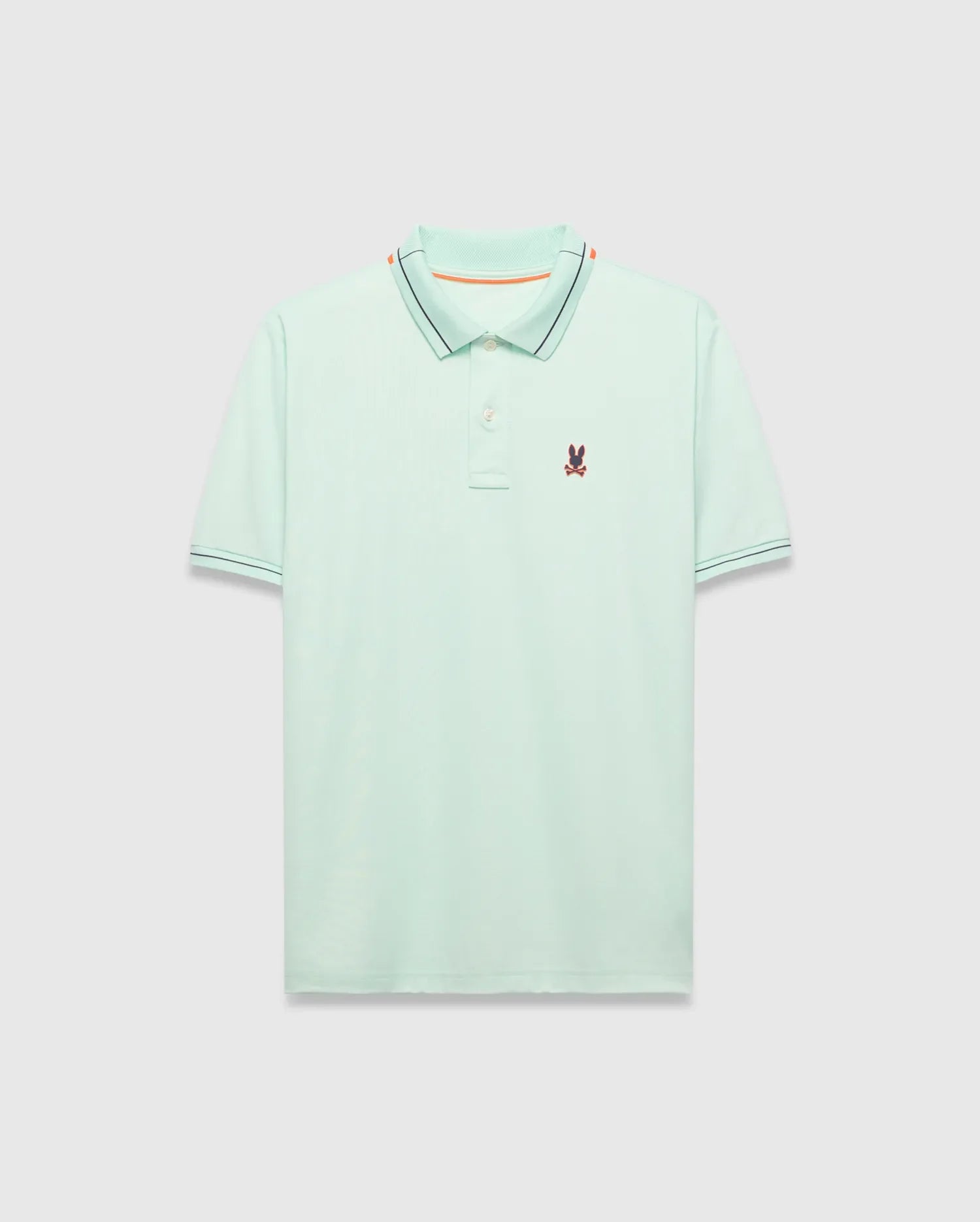 Mens Edwin Sport Polo, a classic fit light green pique polo with a black and orange striped collar, matching black striped cuffs, and a small embroidered Psycho Bunny skull logo on the left chest.