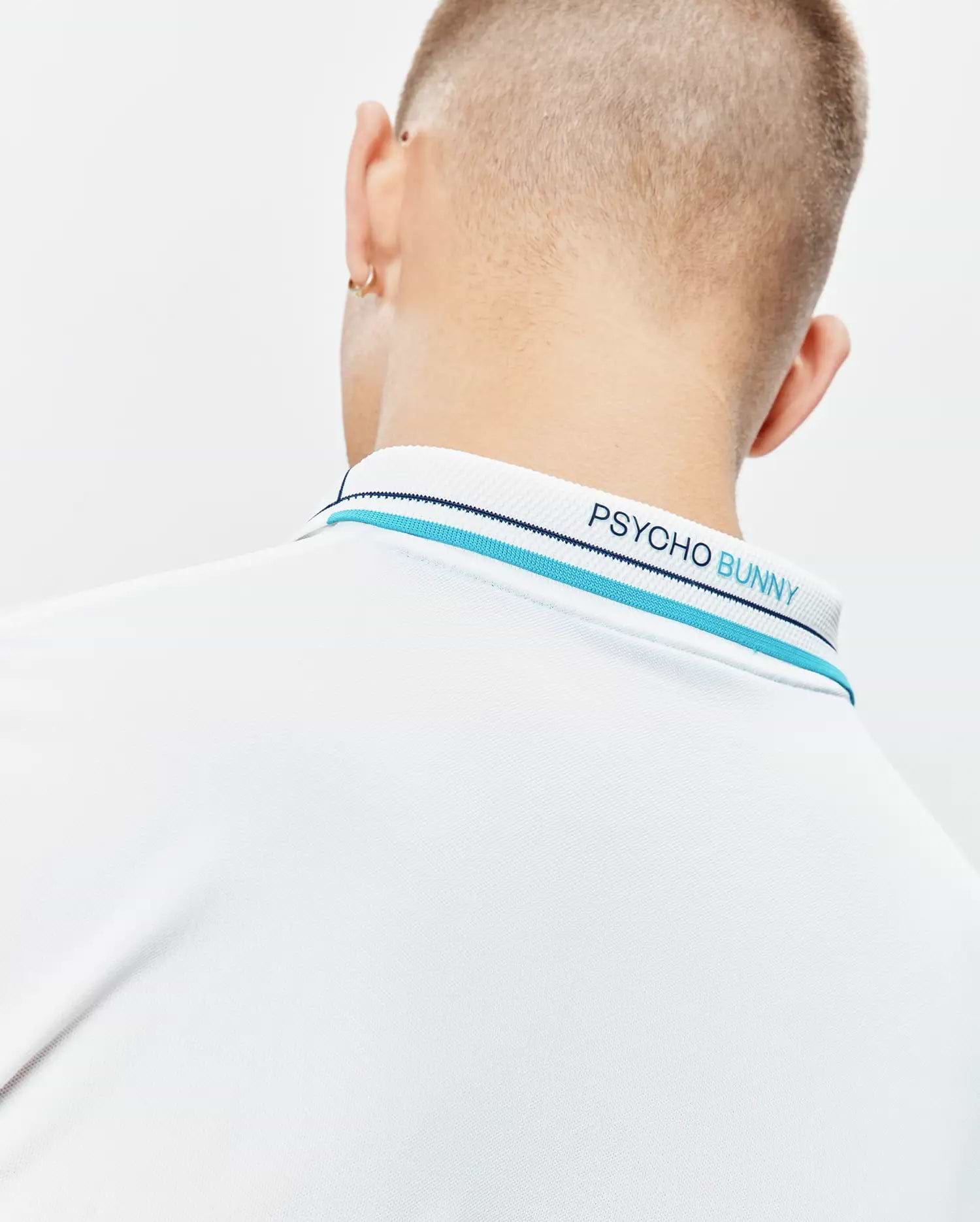 Mens Edwin Sport Polo, white pique polo with a ribbed collar featuring light blue and navy stripes and embroidered Psycho Bunny text in blue on the back neck.